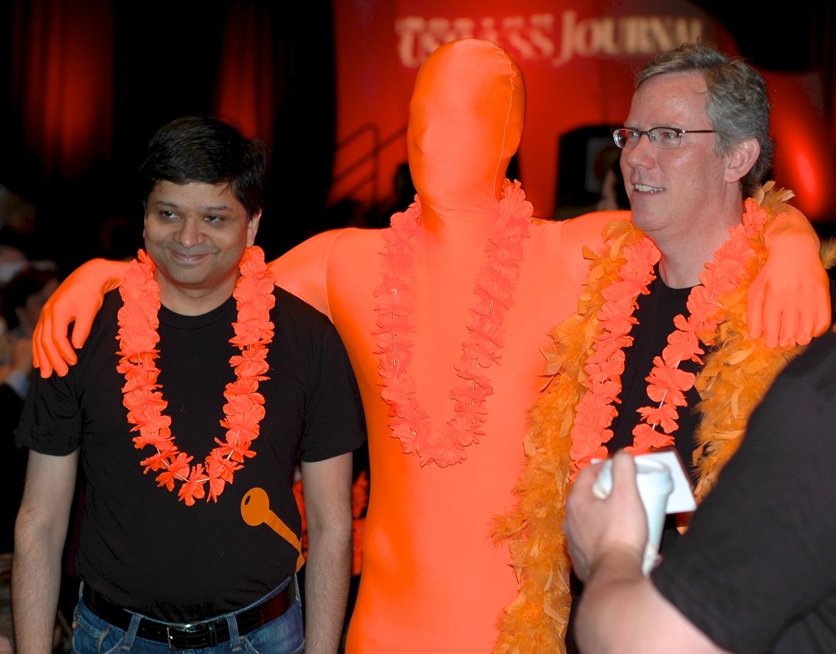 Dharmesh Shah and Brian Halligan With A HubSpot Orangeman