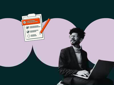 man writing a website design proposal at his laptop