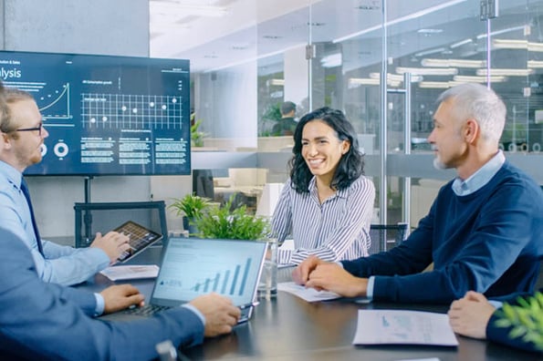 Group of advertisers discussing ad tracking