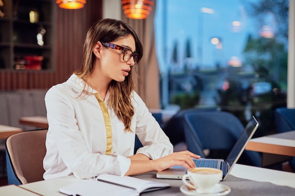 Business owner using laptop to learn how to create blog WordPress