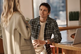 Man and Woman talking with laptop
