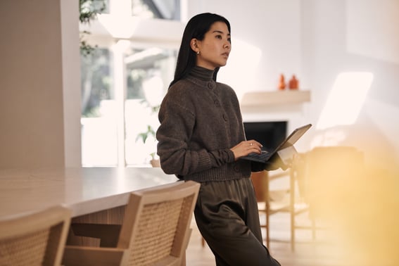 Woman in kitchen with iPad