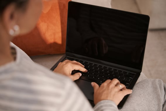 OTS laptop woman on couch