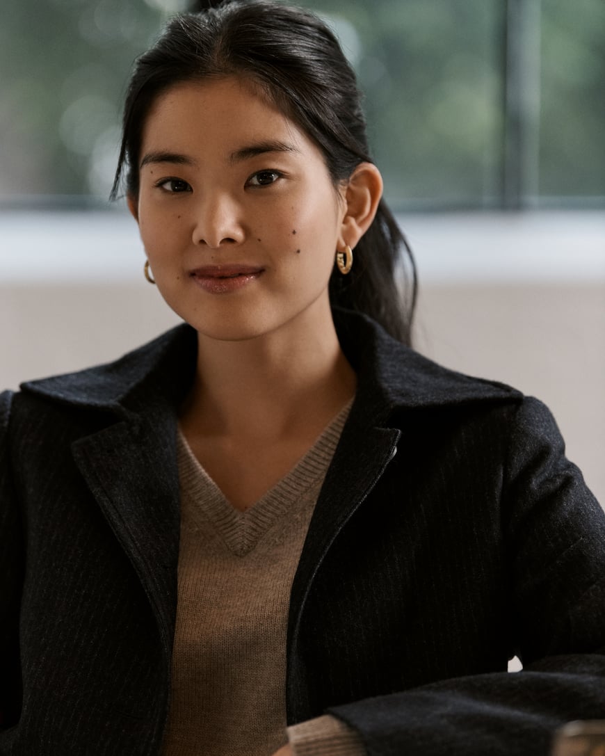 Woman to camera wearing jacket