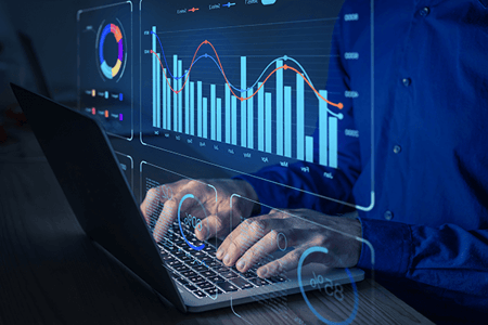 Analyst arbeitet an einer Datenvisualisierung mit Diagrammen, Metriken und KPIs