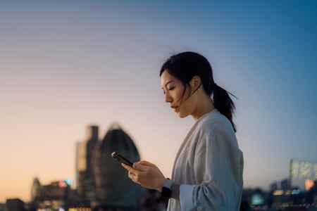 Woman looks at phone