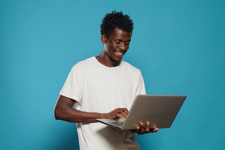 person viewing monochromatic websites on a laptop