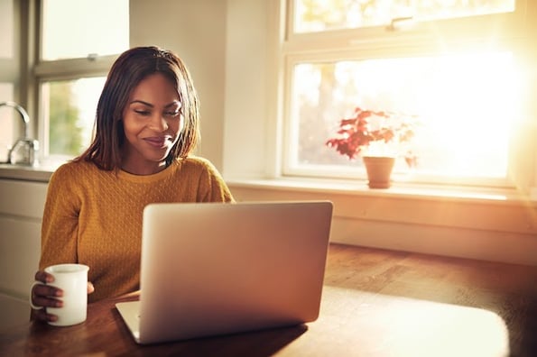 person using a computer at a desk to compress their website files with GZIP compression