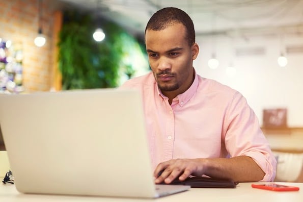 man using a laptop to get an SSL certificate for a wordpress website