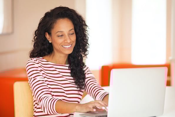 woman using a computer to create a forum in WordPress