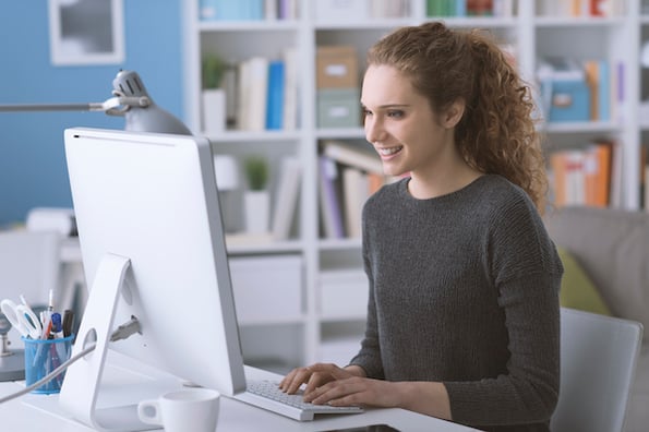 businessperson using a computer to install WordPress on Bluehost