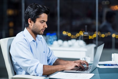 Businessman working on laptop in the office-1