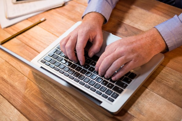 Businessman working on laptop in the office.jpeg