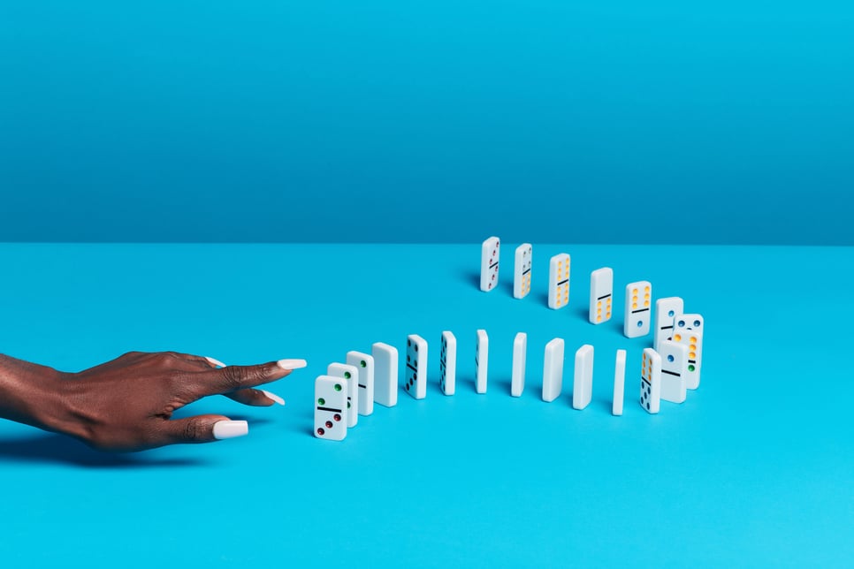 Dominoes stood up and about to be knocked over