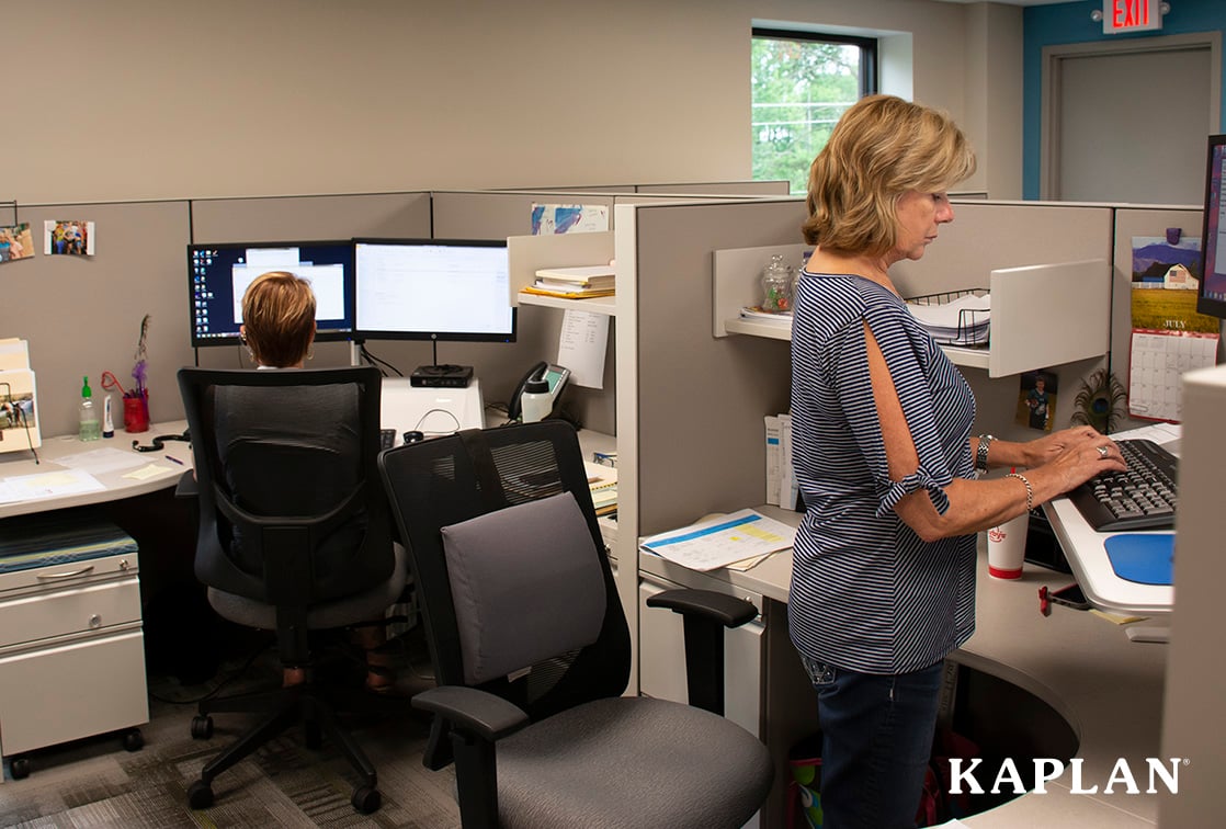 Kaplan_employees at desk_1118x756