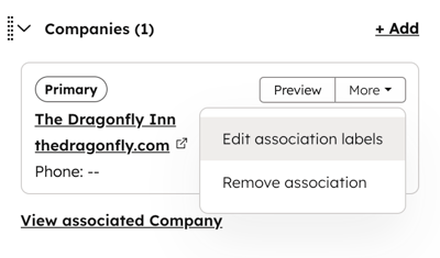 A contact record's associated company card, highlighting the option to edit the association label between the contact and company.