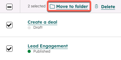 The list of playbooks, with the checkboxes next to two playbooks selected. The Move to folder button at the top of the list is highlighted.