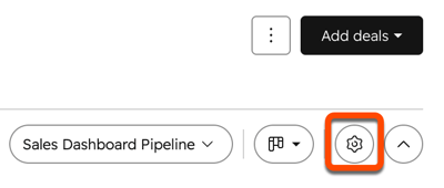 HubSpot deals board view showing the settings icon highlighted next to board view controls.