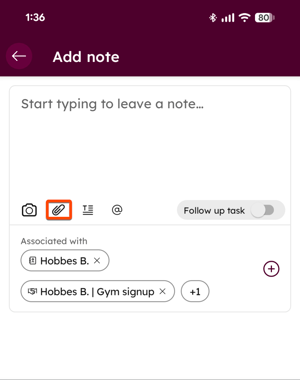 Mobile app screen showing the Add note editor, with the attachment icon highlighted and records associated with the note listed below.