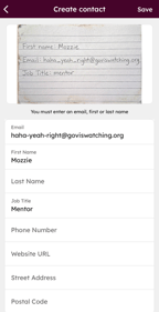 Create contact screen in the mobile app showing a scanned business card image and populated contact fields.