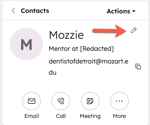 A HubSpot contact record for "Mozzie". An orange arrow points to the pencil icon, indicating the option to edit the primary display properties.