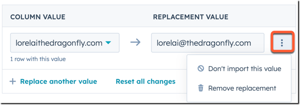 A HubSpot data import screen showing a value replacement rule: lorelaitthedragonfly.com' is being replaced by 'lorelai@thedragonfly.com'. An ellipses menu is open, offering 'Don't import this value' and 'Remove replacement'.