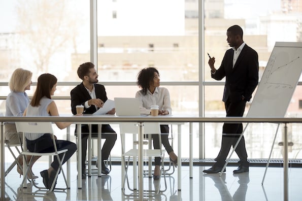 Manager explaining to his team how CRM evolved