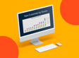 Desktop computer displaying a colorful bar graph titled 