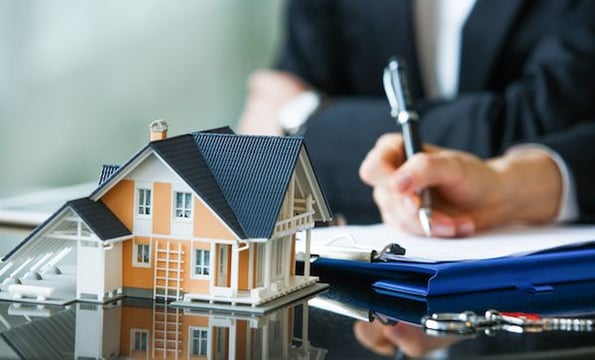 someone planning their real estate business at a desk