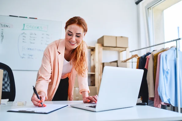 Person working on fulfilling online orders thanks to the help of the best WooCommerce plugin