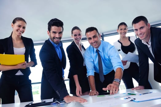 Group of happy young business people in a meeting at office-1