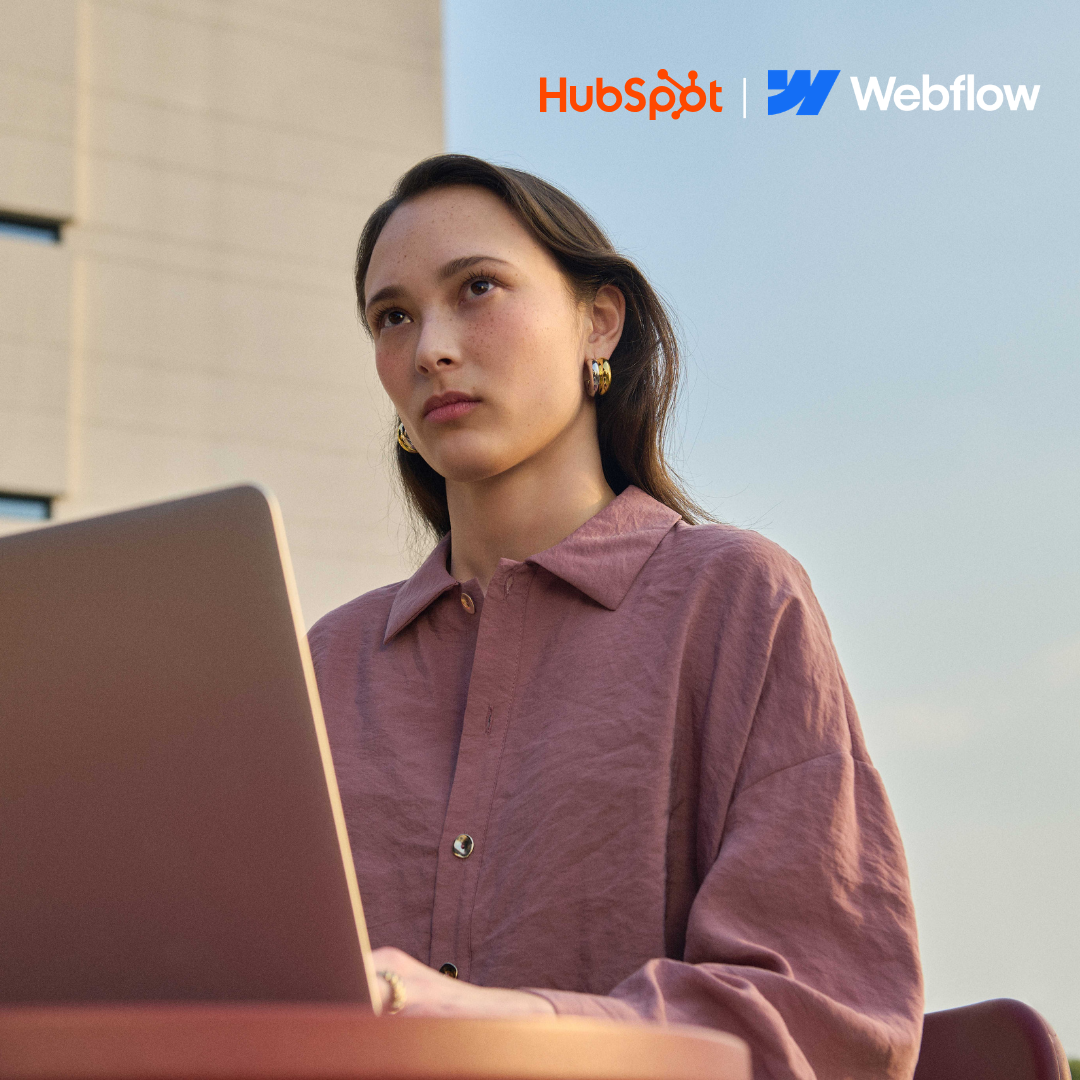 woman at laptop with logos