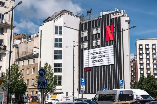 a billboard from netflix advertising the come back of the witcher