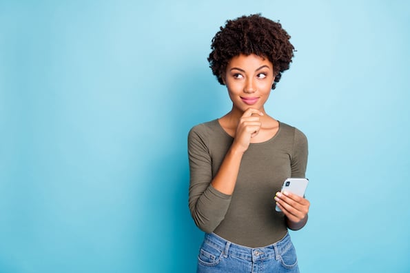 Woman looks at the best social media listening and social media tracking tools