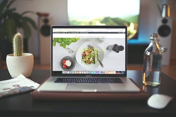 image of a laptop with free stock photo site on the screen