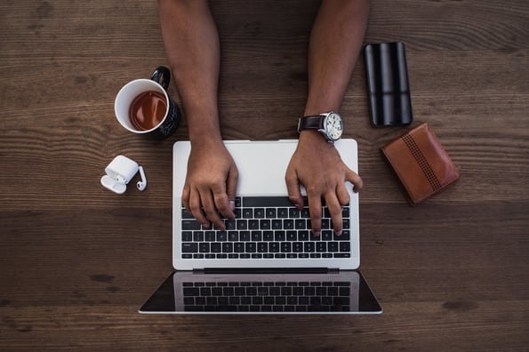 busy-hands-typing-in-flatlay