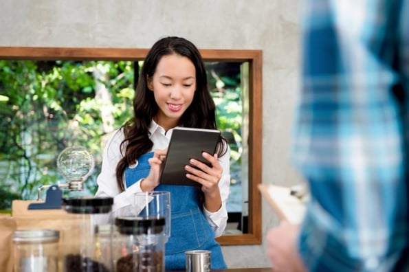 Customer Service Rep reviewing customer satisfaction metrics