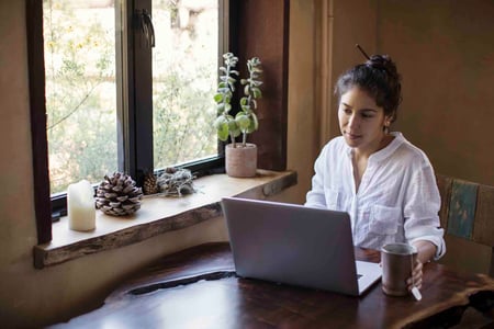 person reads customer retention email on laptop