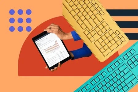 data visualization on an ipad surrounded by keyboards