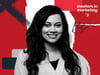Deesha Laxsav, a smiling woman with long dark hair