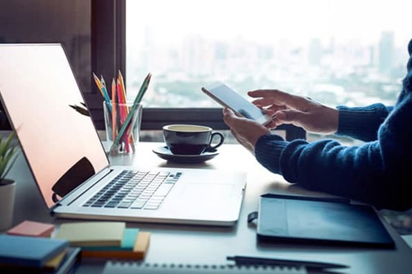 A person reads a blog post at work.