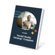 A man smiling while working on a laptop, holding a coffee mug, with a book titled 