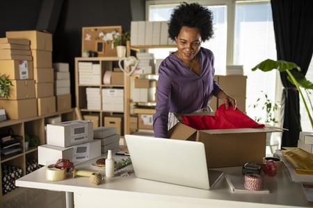 Small business owner uploads products to her website which was created using an ecommerce API