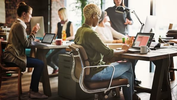 woman creating email and checking email benchmark data