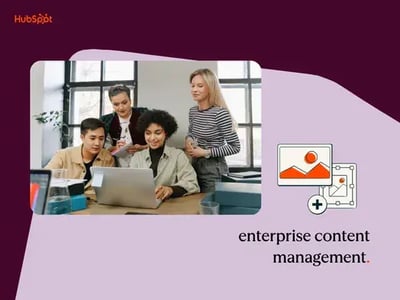 enterprise content management: four coworkers gathered around a laptop