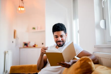 salesperson reads book about entrepreneurship