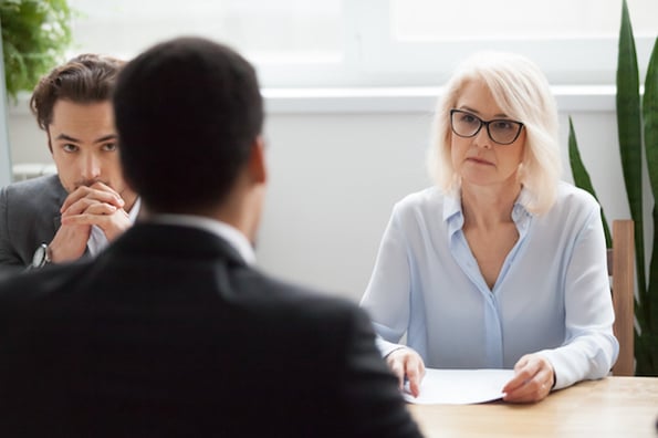 Two HR reps conducting an exit interview