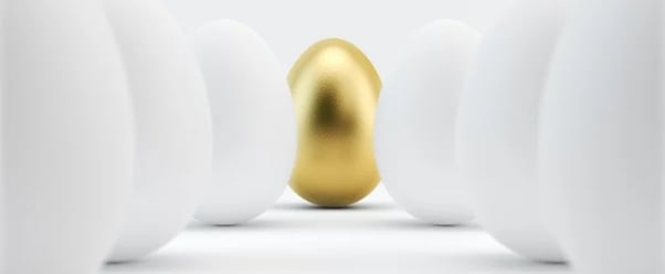 the golden age of advertising: image shows golden egg among white eggs