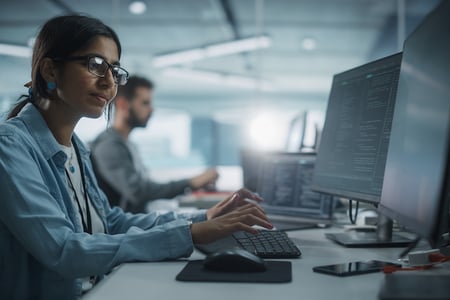 person using google apis on a computer in an office