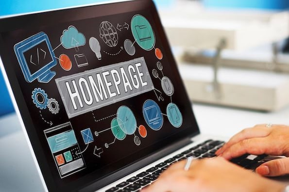 a laptop screen displaying the word homepage
